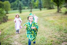 Load image into Gallery viewer, The poncho can be placed over the seat in the back so as not to create excessive bulkage behind your child’s head when in the car or stroller.