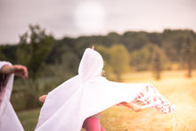Load image into Gallery viewer, You can put the poncho on your child to walk from home to the car, then lift the poncho front, buckle up your child, and put the poncho back down over your child. That’s it! hassle free safety, comfort and warmth.